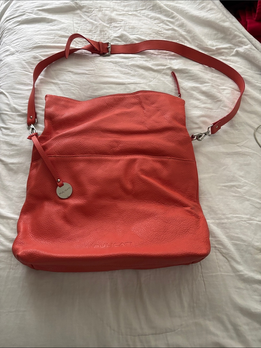 Pulicati Coral-Red Pebbled Leather Shoulder Bag with Charm